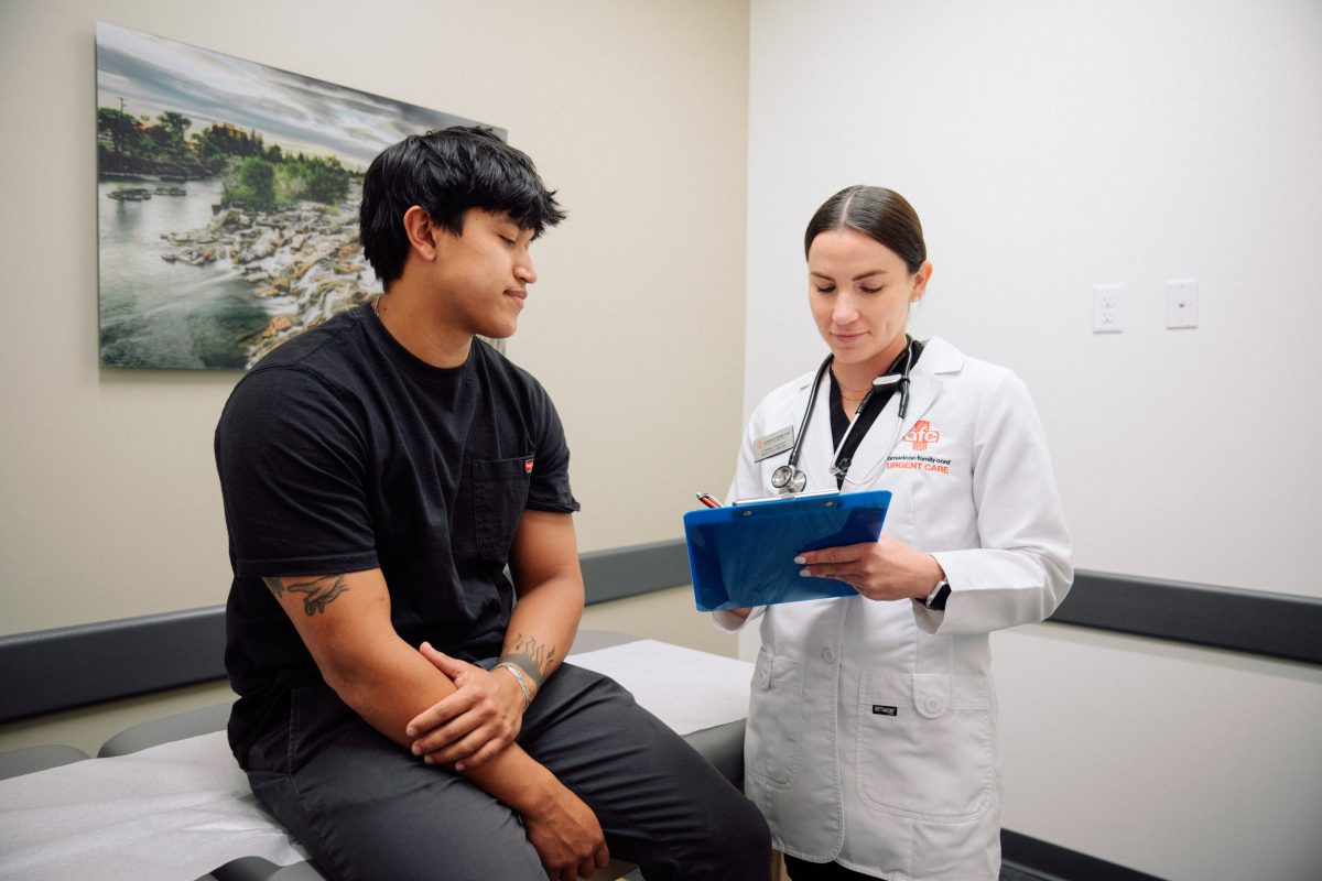 AFC provider reviews chart with patient